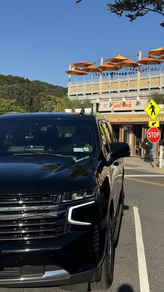 Luxury black SUV for coastal excursions and wine tour transportation